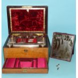 A Victorian brass inlaid rosewood dressing case fitted with cut-glass bottles with plated mounts and
