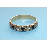 A 9ct gold seven-stone sapphire and diamond ring collet-set four brilliant-cut diamonds and three