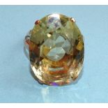 A gold dress ring set very large oval citrine, (approximately 22cts), unmarked, tested as 9ct