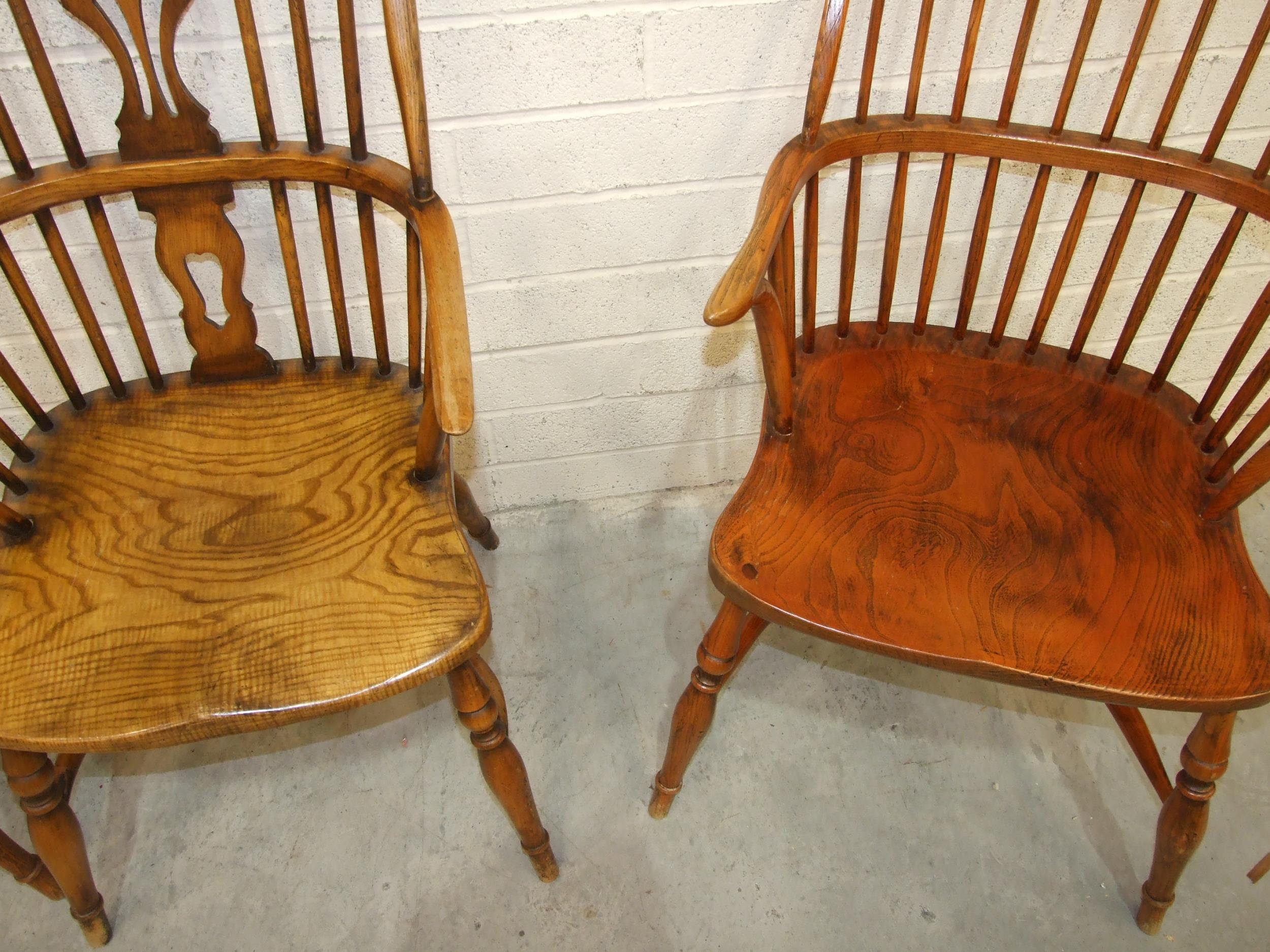 A pair of elm and beech comb-back Windsor chairs with crinoline stretchers and turned legs, (reddish - Image 4 of 4