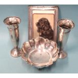 A silver bonbon dish with pierced decoration raised on three scroll legs, 14cm diameter, maker