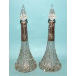 A pair of cut-glass scent bottles of conical form with silver mounts, by William Henry Sparrow,