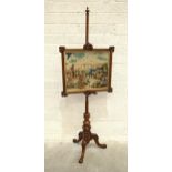 A Victorian rosewood pole screen with turned and carved tripod, supporting a rectangular carved