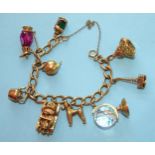 A 9ct gold curb-link bracelet with nine various charms, gross weight 48.5g.