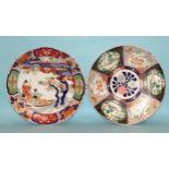 A large Japanese wall charger decorated with figures in a boat, in Imari colours, 46cm diameter