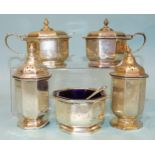 A five-piece silver cruet of octagonal form, with finialled lids and associated spoons, Mappin &