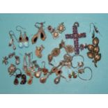 A silver cross pendant set amethysts, a leaf brooch and twenty-three pairs of earrings, mainly