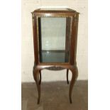 A 19th century Continental four-sided glazed display cabinet on cabriole legs, with overall gilt
