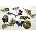 A Trifari leaf brooch and other costume jewellery.