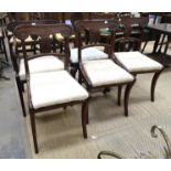 Four George IV mahogany dining chairs with drop-in seats, on sabre legs, including one armchair, (
