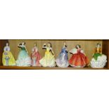 A collection of seven Royal Doulton figurines: 'Nicole' HN4112, 'First Waltz' HN2862, 'Madeline'