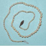 A necklace of graduated cultured pearls, with marcasite-set clasp, 49cm.