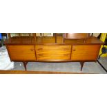 An A Younger Ltd 1960's/70's hardwood sideboard fitted with two cupboards and three central drawers,