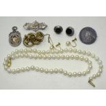 A string of uniformly-sized cultured pearls, 52cm long, a pair of 9ct gold cultured pearl