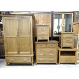 A modern, possibly elm, double-door wardrobe, 114cm wide, (slight damage to back of cornice), a