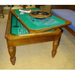 A modern wood frame combination games table, including roulette wheel, blackjack and craps, all