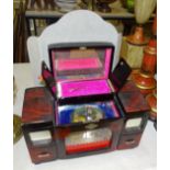 A lacquered musical jewellery box with figural scene and three small mirrored display stands, (one