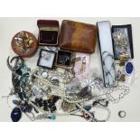 A quantity of costume jewellery and some silver jewellery.