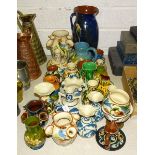A collection of Torquay pottery, including udder vases, jugs, bowls, (some damages).