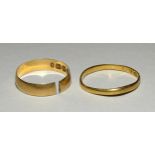 A small 22ct gold wedding band, size L, 1.2g and an 18ct gold wedding band, (sawn), size H½, 1.