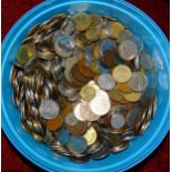 A large collection of British and World coinage, including a small quantity of silver, contained