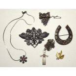 A Victorian silver horseshoe brooch, a bunch of grapes brooch set foiled stones, a modern Art