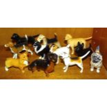 A collection of eleven small Beswick dog figures, including 'Beagle Wendover Billy', 'Dachshund