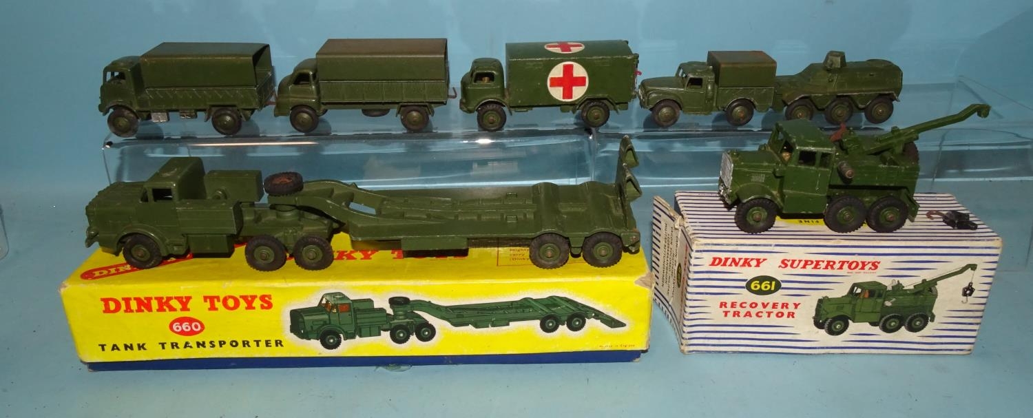 Dinky Toys, 661 Recovery Tractor, 660 Tank Transporter, (both boxed) and five Dinky Army