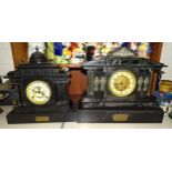 A large black slate striking mantel clock of architectural design, 48cm wide, 41cm high, with