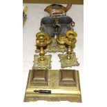 An embossed brass double inkstand, 18 x 10cm, a pair of matching candlesticks, 16cm high, another