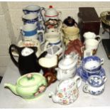 A Carltonware leaf and floral-decorated teapot, three cottage teapots, novelty and other teapots,