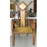 A craftsman-made iron garden armchair, having a high back and deep seat, 137cm high, 68.5cm wide,