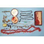 A gun-metal guard chain, spectacle-set white paste stones, a coral twig necklace, a pair of