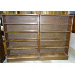 A pair of plain oak open bookshelves, each with four fixed shelves, 109cm wide, 160cm high, (2).