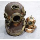 A half-size replica copper and brass diver's helmet, 38cm high and a miniature model of a diver's