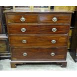 A late George III mahogany rectangular chest of two short and three long cock-beaded drawers on