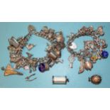 Two silver charm bracelets with sixty various charms, 190g.