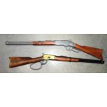 A replica of the John Wayne Winchester rifle, probably by Denix, marks to the stock, together with