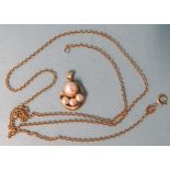 A 9ct gold neck chain, 57cm, 3.9g  with 18ct gold pendant set cultured pearls, 3g.