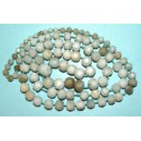 A long string of graduated faceted jade beads, largest 15mm diameter, 14mm long, smallest 5 x 5mm,