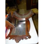 A Georgian mahogany cheese coaster, 43cm, in need of restoration, an oval tray, wall mirror,