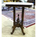 A late 19th century small stained wood table on four turned columns extended to legs with shaped