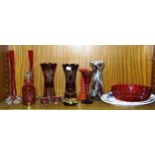 A Cranberry glass decanter with etched fruit and leaf decoration, 17cm high, and other red