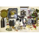 A collection of modern metal and cloth military badges, a pair of Hiatt handcuffs, a Zippo