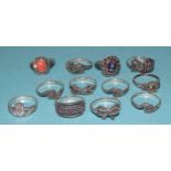 Twelve various silver rings set marcasite, amethyst and coral.