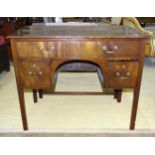 A 19th century mahogany knee-hole dressing table the rectangular top above a single freeze drawer, a