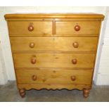 A Victorian pine chest of two short and three long drawers, on turned legs, 108cm wide, 114cm high