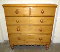 A Victorian pine chest of two short and three long drawers, on turned legs, 108cm wide, 114cm high