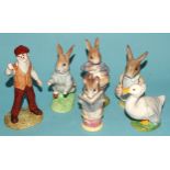A collection of eleven Beswick Beatrix Potter figures, including 'Peter With Postbag', 'Mrs Flopsy