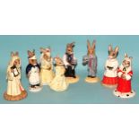 A collection of sixteen Royal Doulton 'Bunnykins' figures, including 'Bride', 'Groom', 'Bridesmaid',